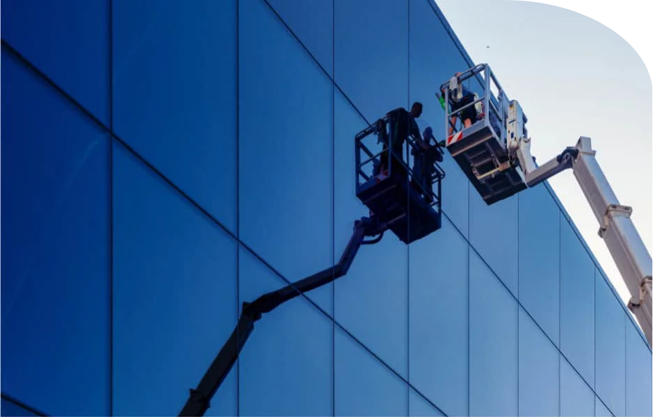 Detailed facade cleaning of modern architectural glass and external panelling on a Western Sydney strata property.