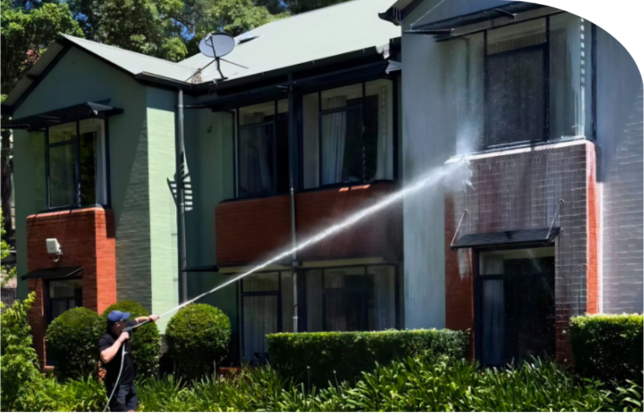 Low pressure softwashing of delicate exterior residential walls in the Western Sydney to safely remove environmental build-up.
