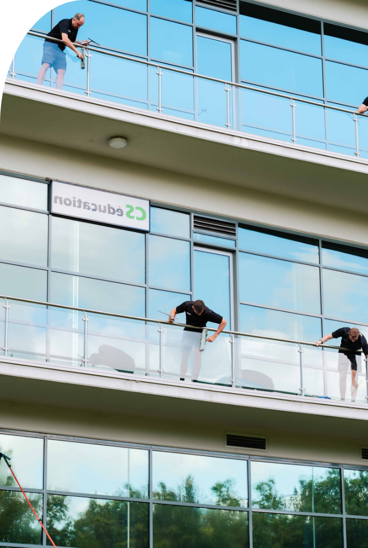 Complete guide to cleaning windows at home — Shimmer Glass and Pressure Cleaning technician demonstrating professional window cleaning technique in Sydney